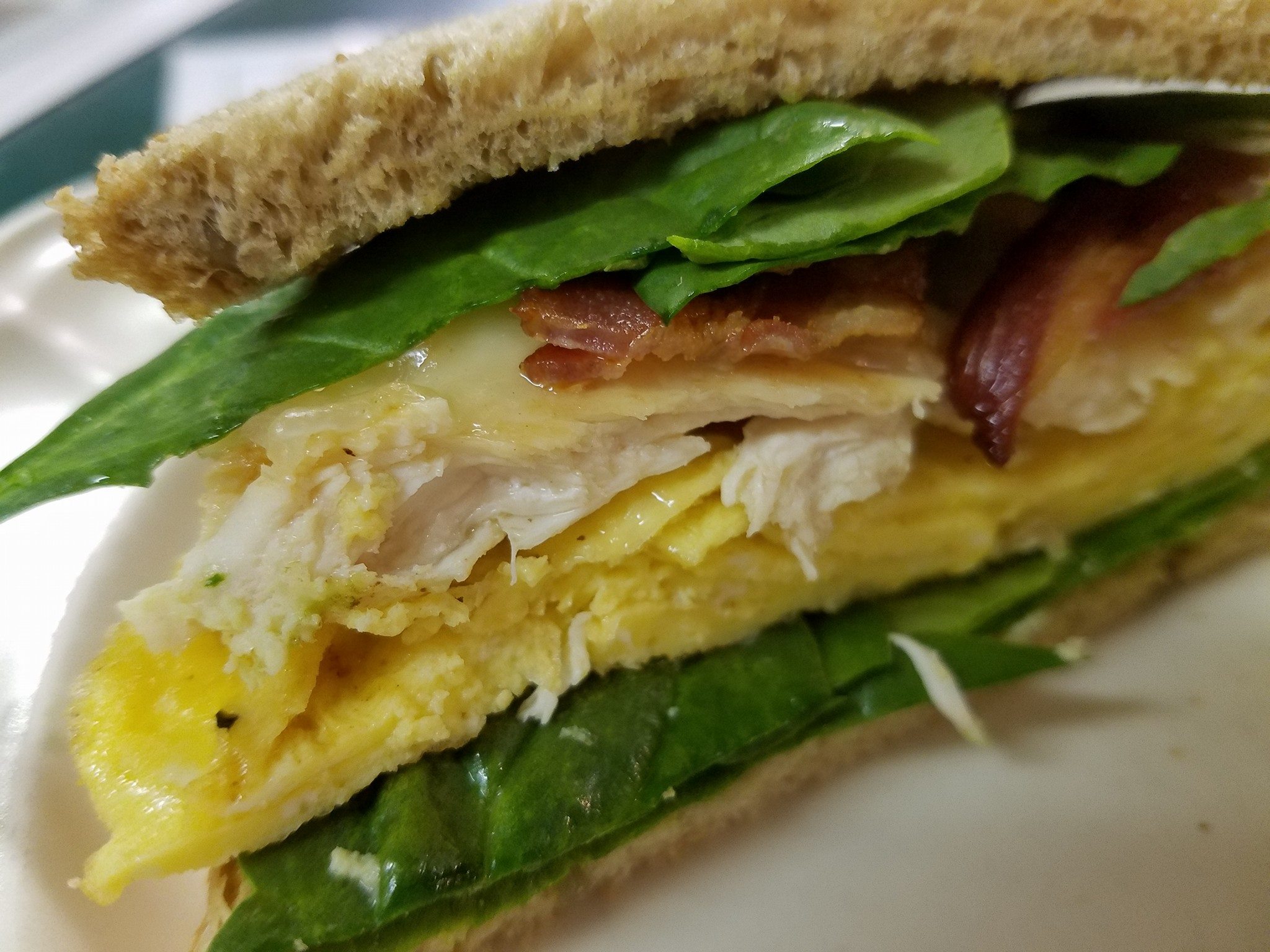 chicken spinach bacon swiss egg sandwich on toast